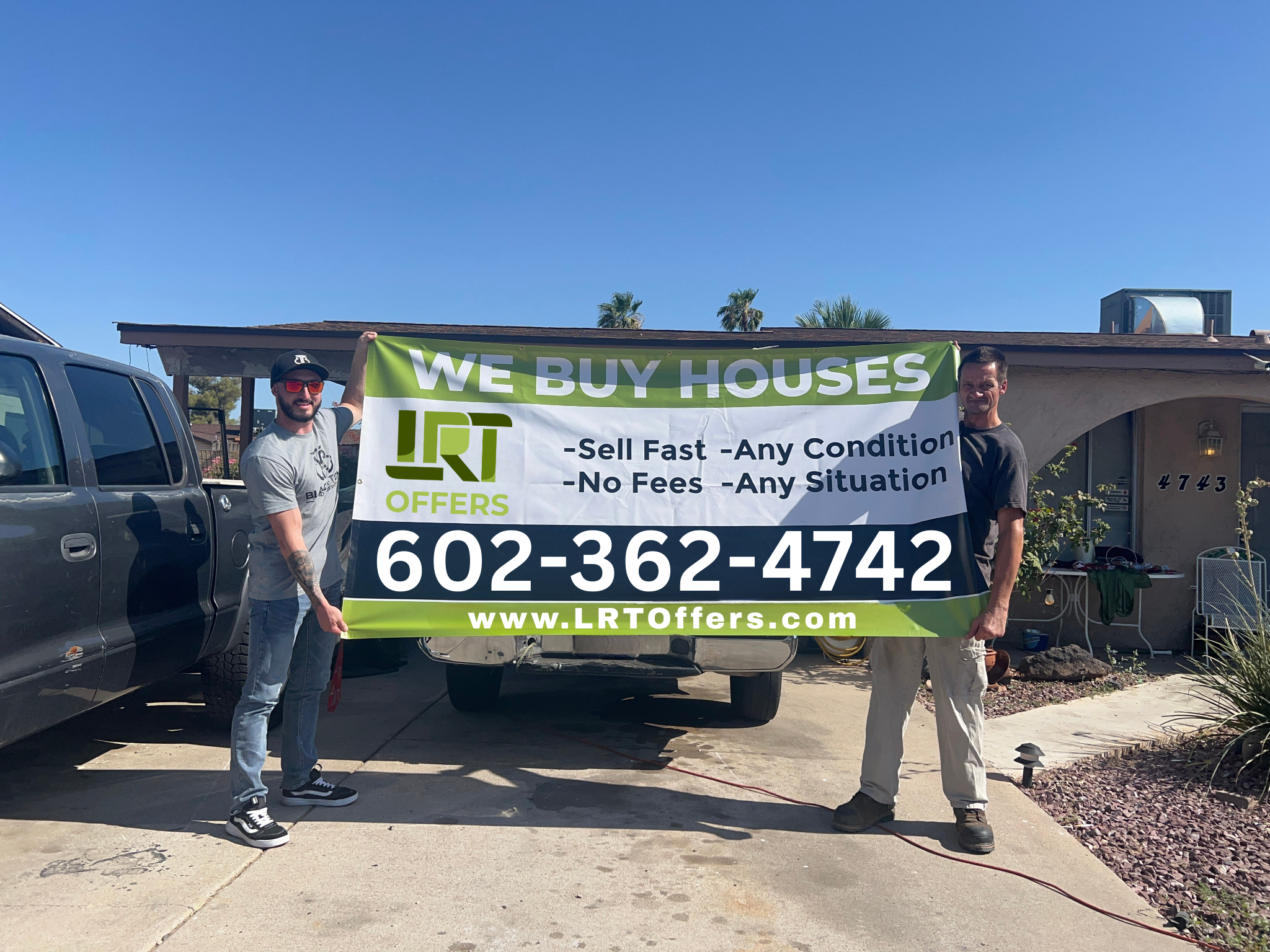 Jake from LRT Offers holding a We Buy Houses banner with a happy seller wanted to sell your house fast in Glendale, AZ